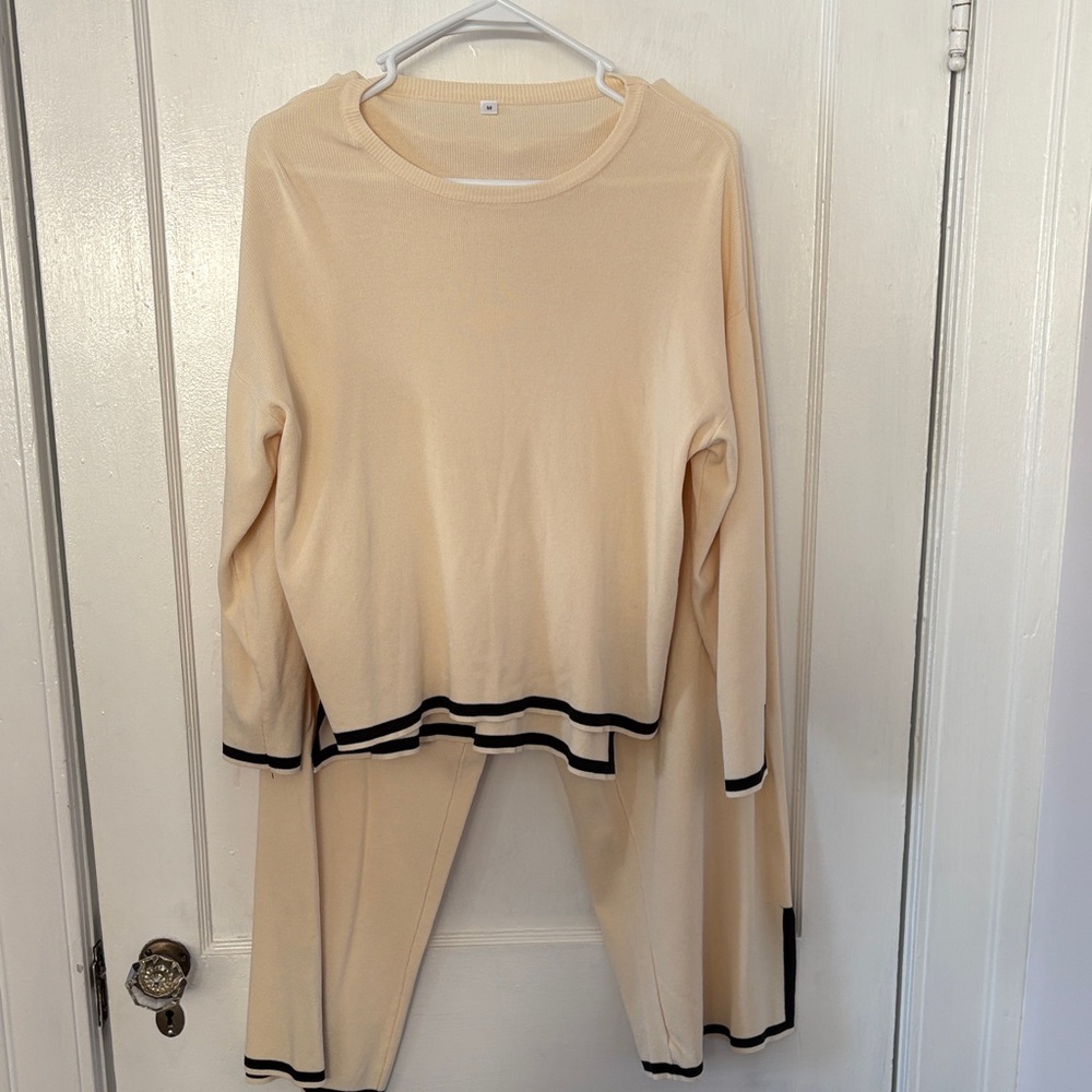 Elegant Cream Women's Top with Black Trim